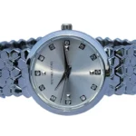 Michael Kors white dial truncated icosahedron chain watch with crystal hour markers.